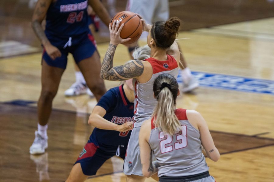 Corina Carter (1) pulls up for a jump shot over her opponent, during the Air Force Reserve Mountain West Women's basketball tournament Mar. 9. California State University Fresno upsets the number 1 seed University of New Mexico 77-72. (Devin Cornelius | Collegian) 