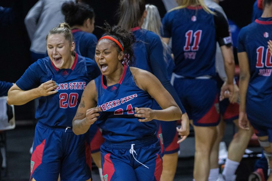 Bree Delaney (20) and Wytalla Motta (24) celebrates after their team the California State University Fresno Bulldogs takes down the number 1 seed University of New Mexico Lobos, during the Air Force Reserve Mountain West Women's basketball tournament Mar. 9. Fresno State upset the New Mexico 77-72. (Devin Cornelius | Collegian) 