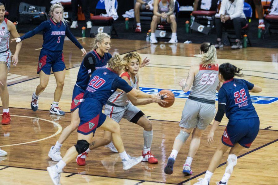 LaTora Duff (5) Looks to pass to a teammate after driving into the paint, during the Air Force Reserve Mountain West Women's basketball tournament Mar. 9. California State University Fresno upset the New Mexico 77-72. (Devin Cornelius | Collegian) 