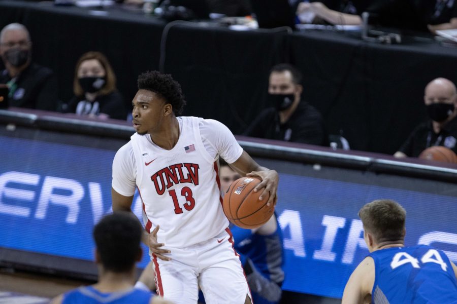 Bryce Hamilton (13) looks to pass, during the Air Force Reserve Mountain West men's basketball tournament in Las Vegas. The University of Nevada Las Vegas defeats the United States Air Force Academy 80-52 (Devin Cornelius | Cornelius)