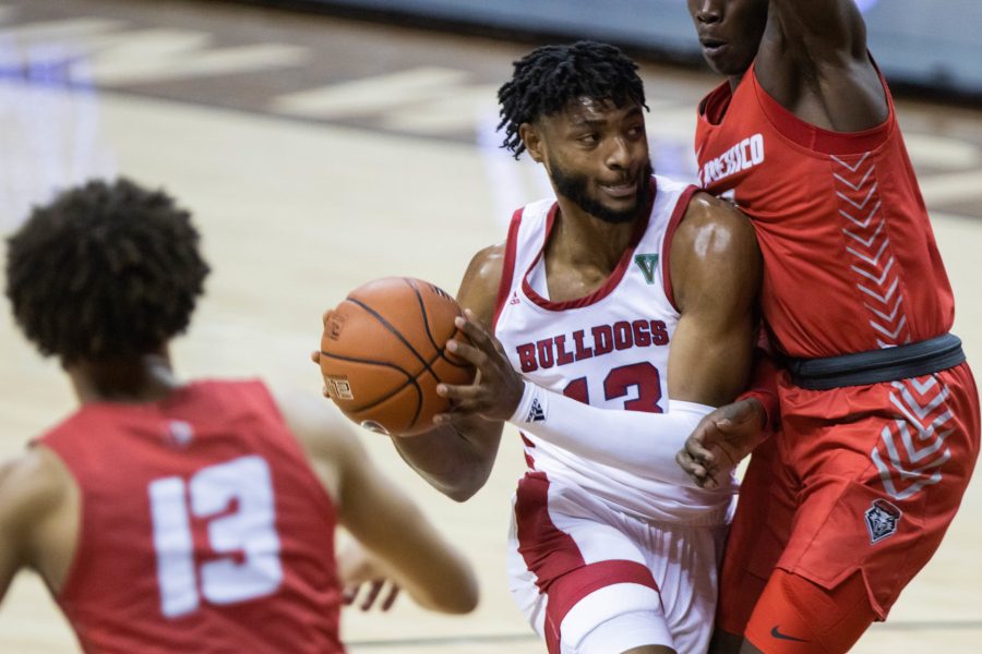Deon Stroud (13) looks to pass after driving towards the basket, during the Air Force Reserve Mountain West men's basketball tournament in Las Vegas.  (Devin Cornelius | Cornelius)