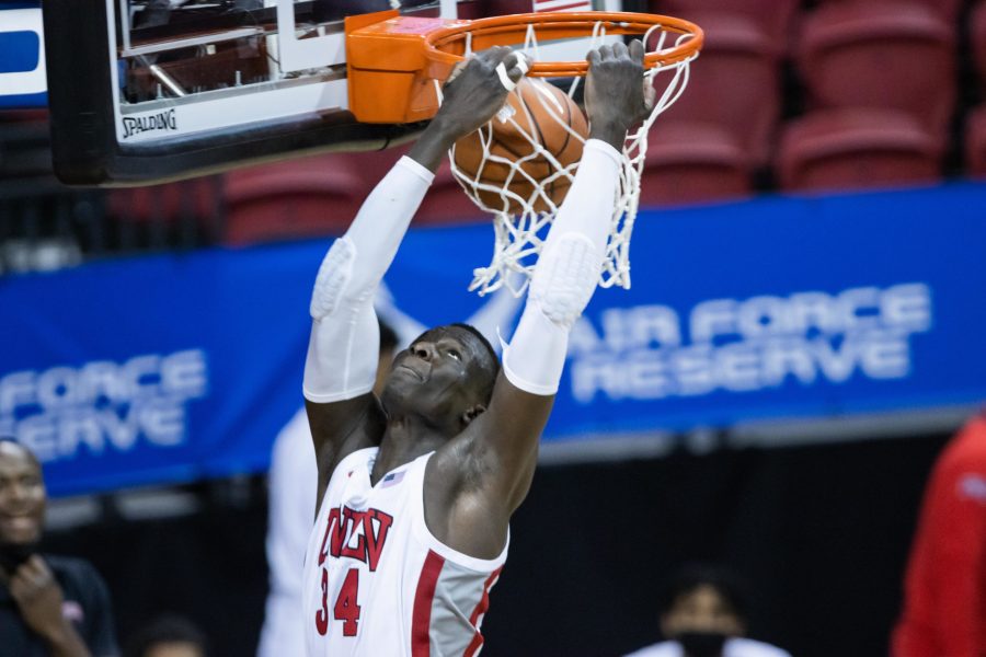 Cheikh Mbacke Diong (32) makes a reverse dunk, during the Air Force Reserve Mountain West men's basketball tournament in Las Vegas. The University of Nevada Las Vegas defeats the United States Air Force Academy 80-52 (Devin Cornelius | The Collegian)