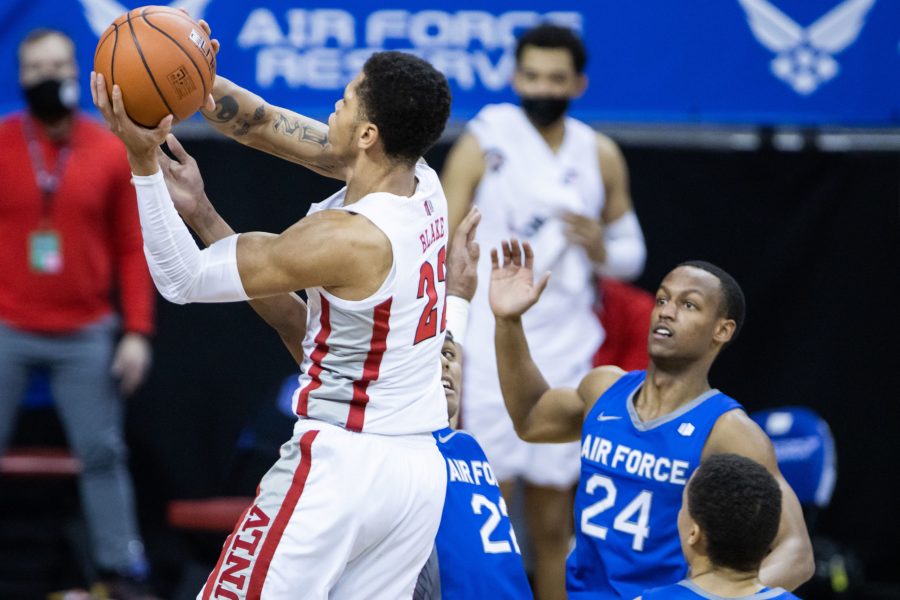 Nicquel Blake (22) drives past a defender and attempts a jump shot, during the Air Force Reserve Mountain West men's basketball tournament in Las Vegas. The University of Nevada Las Vegas defeats the United States Air Force Academy 80-52 (Devin Cornelius | Collegian)
