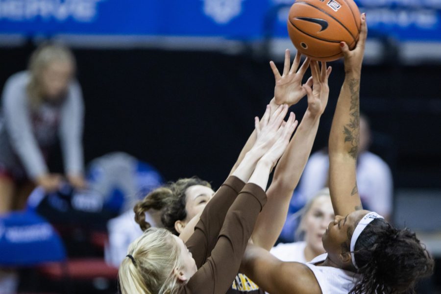 Wytalla Motta (24) attempts to shoot over several defenders, during the Air Force Reserve Mountain West women's basketball championship at the Thomas and Mack center in Las Vegas Nevada. The University of Wyoming takes down California State University Fresno 59-56. (Devin Cornelius | Collegian)