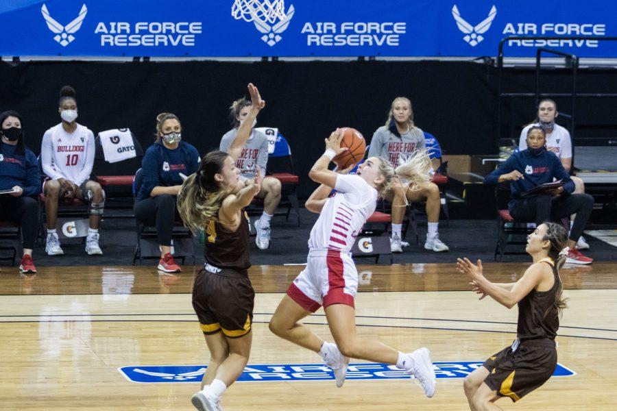 Hanna Cavinder (0) drives past a defender and shoots a layup, during the Air Force Reserve Mountain West women's basketball championship at the Thomas and Mack center in Las Vegas Nevada. The University of Wyoming takes down California State University Fresno 59-56. (Devin Cornelius | Collegian)