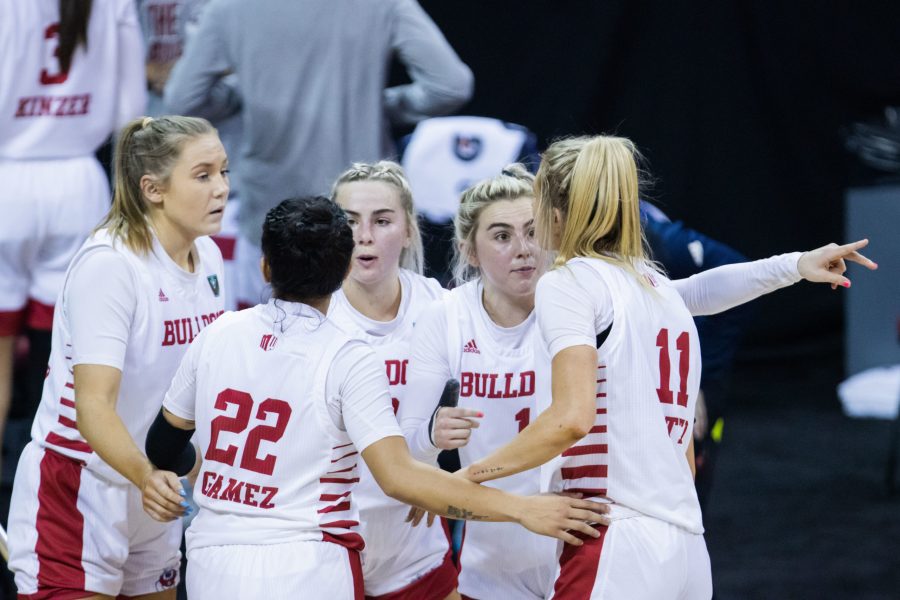 Haley Cavinder (1) talks to her teammate Maddi Utti (11) while they wait for the result of a review during the Air Force Reserve Mountain West women's basketball championship at the Thomas and Mack center in Las Vegas Nevada. The University of Wyoming takes down California State University Fresno 59-56. (Devin Cornelius | Collegian)