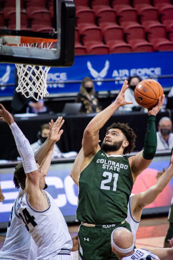 David Roddy (21) attempts to dunk the ball over the opponent, during the Air Force Reserve Mountain West men's basketball tournament in Las Vegas. Colorado State lost the game 62-50. (Tri Duong | The Collegian)