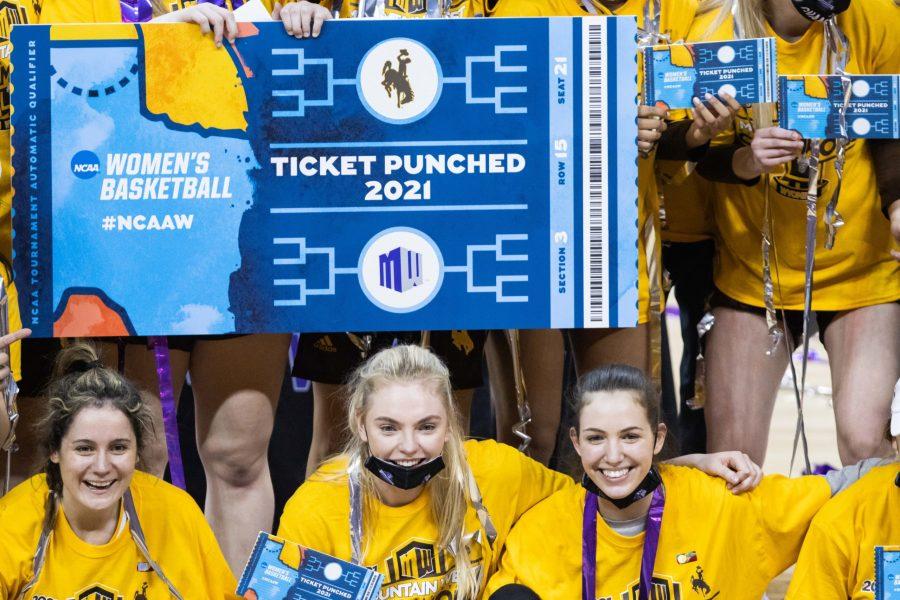 Alba Sanchez Ramos (11) Dagny Davidsdottir (33) and Iris Tsafara (0) smile after getting their ticket punched after defeating the California State University Fresno Bulldogs in the Air Force Reserve Mountain West women's basketball tournament championship game. the University of Wyoming defeats Fresno state 59-56. (Devin Cornelius | Collegian)