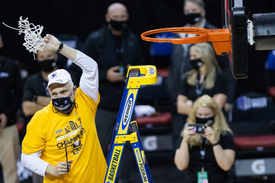 Gerald Mattinson head coach of the University of Wyoming women's basketball team waves the net after defeating California State University Fresno in the championship game at the Air Force Reserve Mountain West women's basketball tournament in Las Vegas Nevada. Wyoming defeats Fresno State 59-56. (Devin Cornelius | Collegian) 