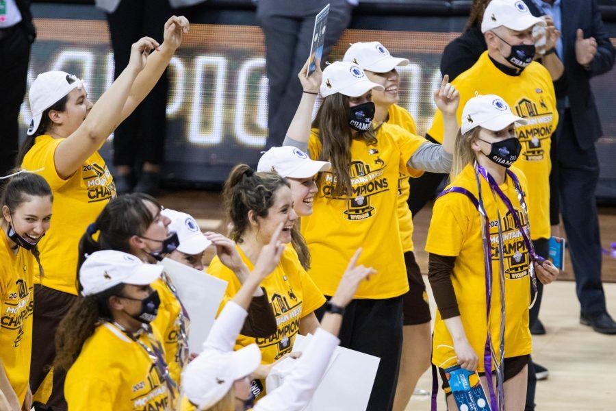 The University of Wyoming womens basketball team celebrates after defeating California State University Fresno in the championship game at the Air Force Reserve Mountain West womens basketball tournament in Las Vegas Nevada. Wyoming defeats Fresno State 59-56. (Devin Cornelius | Collegian) 