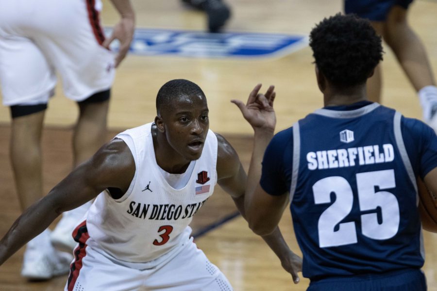Terrell Gomez (3) prepares to defend against Grant Sherfield (25) during the Air Force Reserve men's basketball tournament in Las Vegas Nevada. the University of Nevada loses to San Diego State University 77-70. (Devin Cornelius | Collegian) 