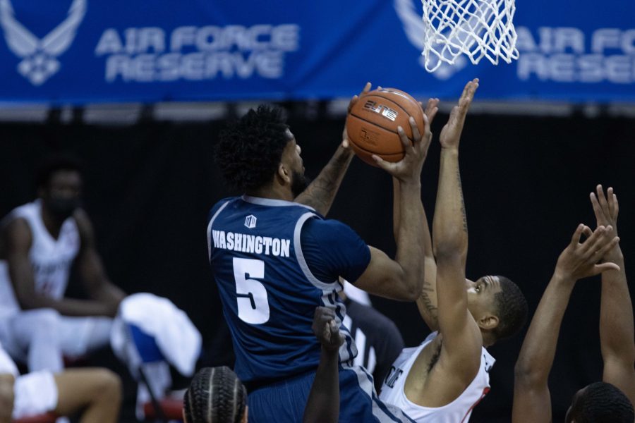 Warren Washington (5) drives into the paint and shoots a layup Mar. 12, during the Air Force Reserve men's basketball tournament in Las Vegas Nevada. the University of Nevada loses to San Diego State University 77-70. (Devin Cornelius | Collegian) 