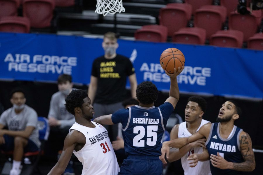 Grant Sherfield (25) drives to the basket and shoots Mar. 12, during the Air Force Reserve men's basketball tournament in Las Vegas Nevada. the University of Nevada loses to San Diego State University 77-70. (Devin Cornelius | The Collegian) 