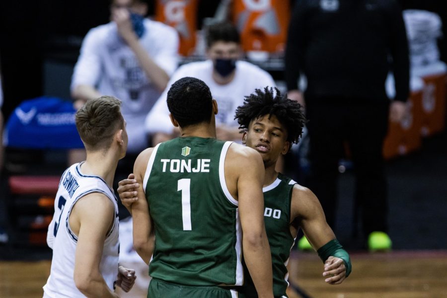 P.J. Byrd (5) celebrates with John Tonje (1) after Tonje gets fouled, during the Air Force Reserve Mountain West men's basketball tournament in Las Vegas. The University lost the game 62-50. (Devin Cornelius | The Collegian)