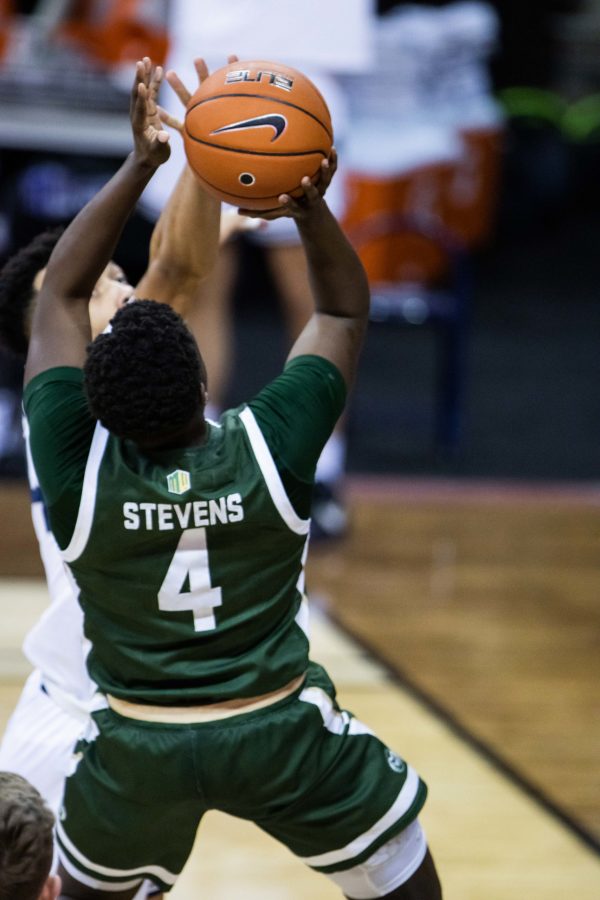 Isaiah Stevens (4) drives under the basket and shoots,  during the Air Force Reserve Mountain West men's basketball tournament in Las Vegas. The Rams lost the game 62-50. (Devin Cornelius | The Collegian)