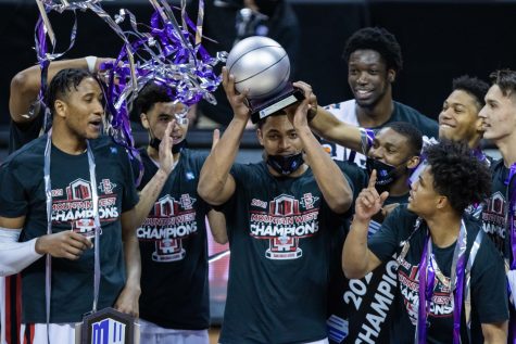 Matt Mitchell (11) holds up the MVP trophy after his team San Diego State University defeated Utah State University to win the Mountain West Championship game. (Devin Cornelius | The Collegian) 