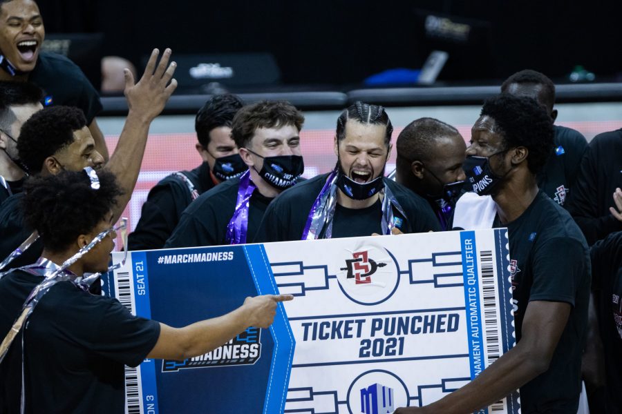 Jordan Schakel cheers with his team after San Diego State University punches their ticket into the NCAA tournament after defeating Utah State University in the Air Force Reserve Mountain West men's basketball championship final. (Devin Cornelius | The Collegian) 
