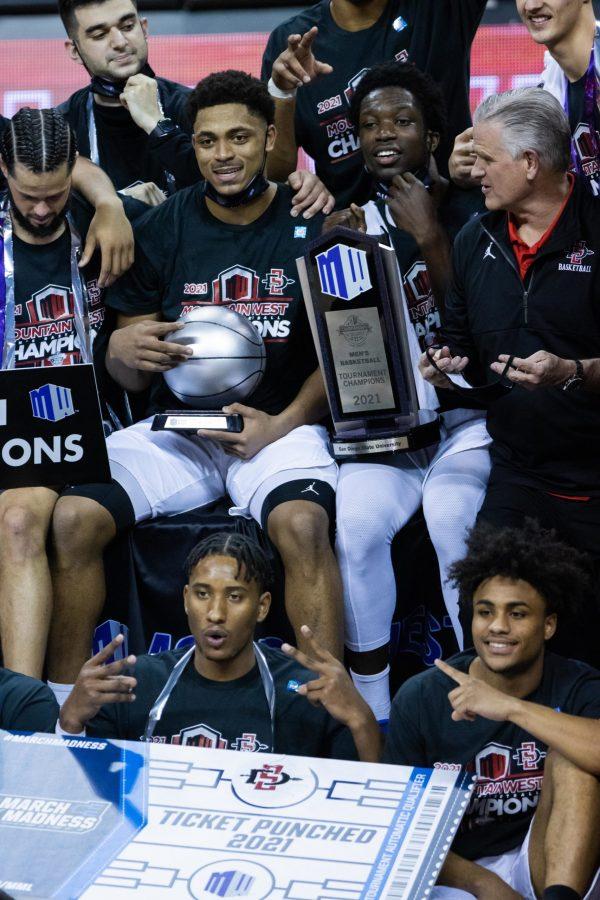 The San Diego State Aztecs celebrate after defeating the Utah State Aggies in the Air Force Reserve Mountain West tournament final. (Devin Cornelius | The Collegian) 