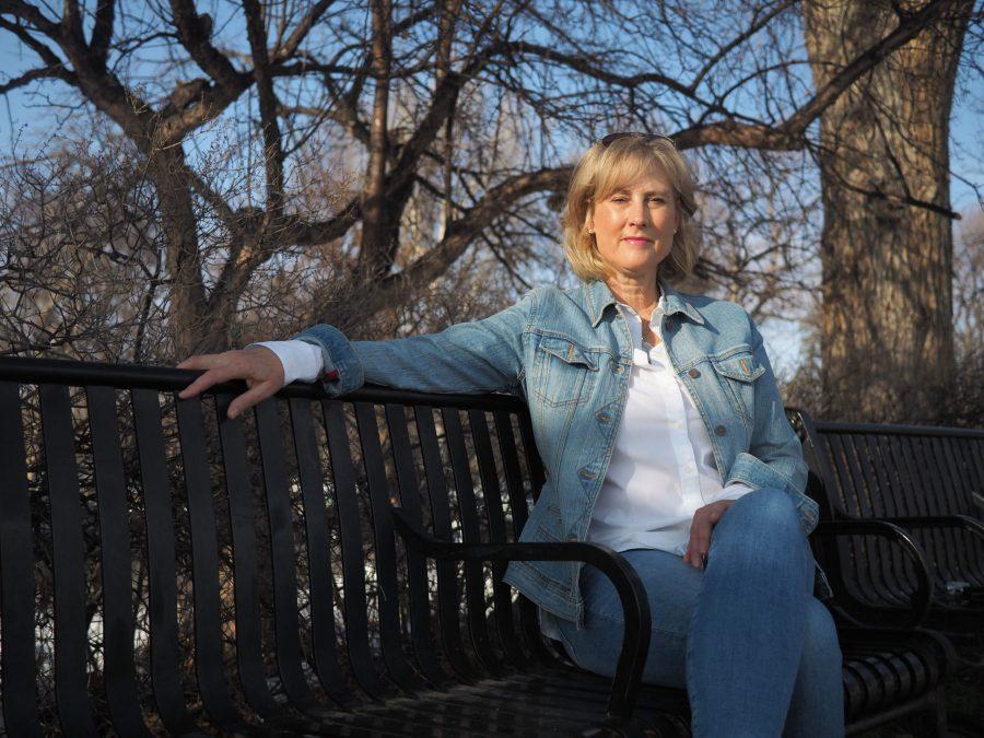 Mayoral candidate Molly Skold sits on a bench in Fort Collins City Park March 20. (Gregory James | The Collegian)