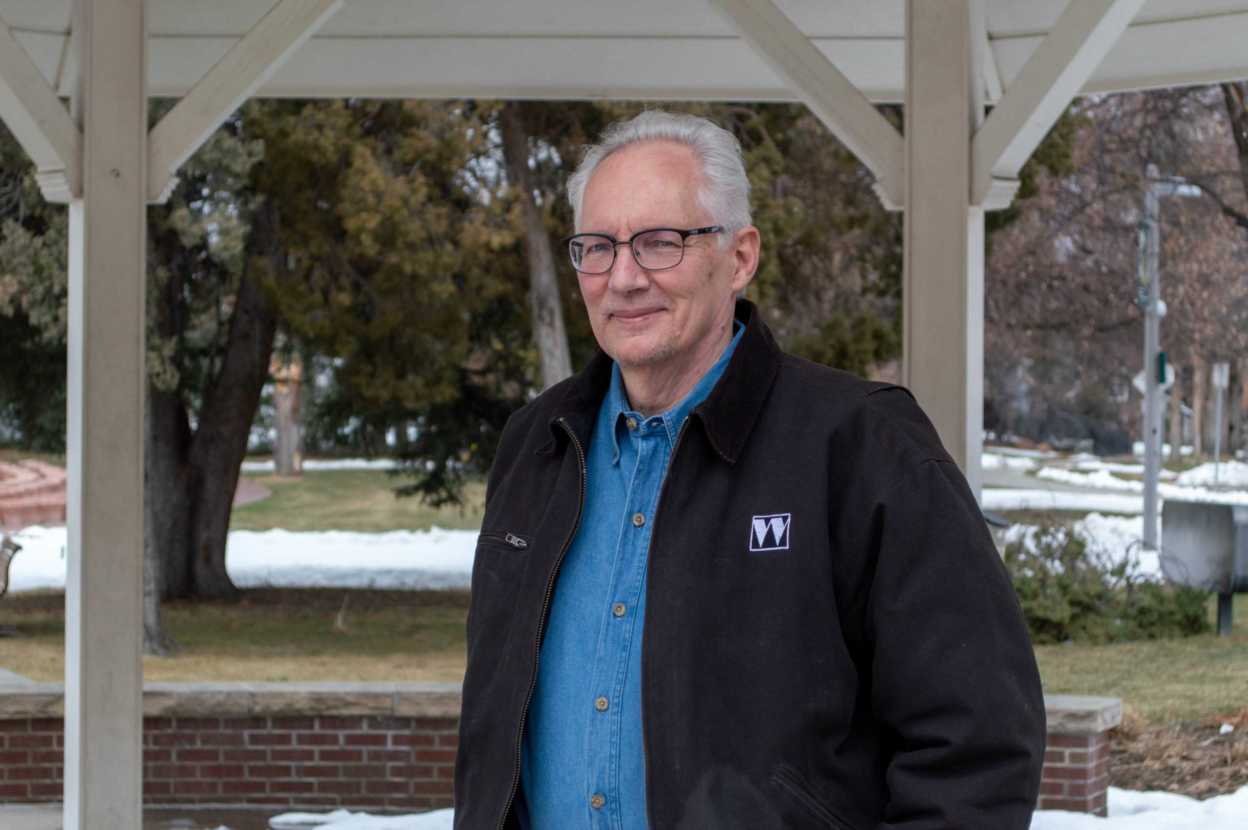 man standing under gazebo