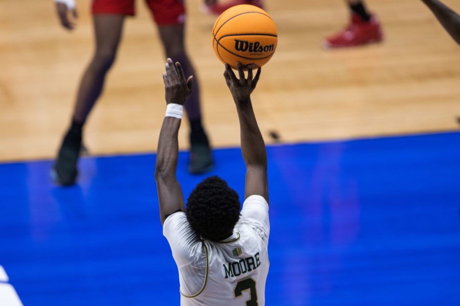 Kendle Moore (3) shoots a three-point shot, during Colorado State University’s basketball game versus North Carolina State University at the National Invitation Tournament in Fresco, Texas in the Comerica Center. Colorado State beat NC State 65-61 March 25. (Devin Cornelius | The Collegian)