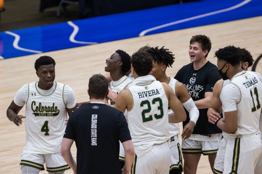 The Colorado State Men’s Basketball team celebrates after defeating North Carolina State University in the National Invitation Tournament quarterfinal game in Fresco, Texas the Comerica Center March 25. Colorado State beat NC State 65-61. (Devin Cornelius | The Collegian)
