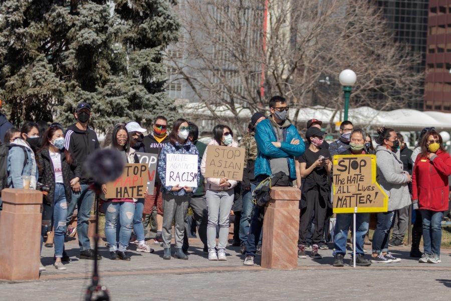 Protesters hold signs outside the Colorado State Capitol March 27. The protest featured speeches, poetry, and music from the Asian-American and Pacific Islander community. (Michael Marquardt | The Collegian)