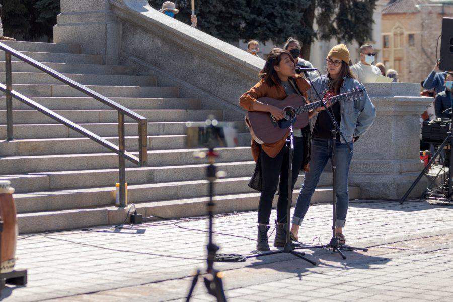 Grace Clark sings and plays guitar during a protest outside the Colorado State Capitol March 27. The protest featured speeches, poetry, and music from the Asian-American and Pacific Islander community. (Michael Marquardt | The Collegian)