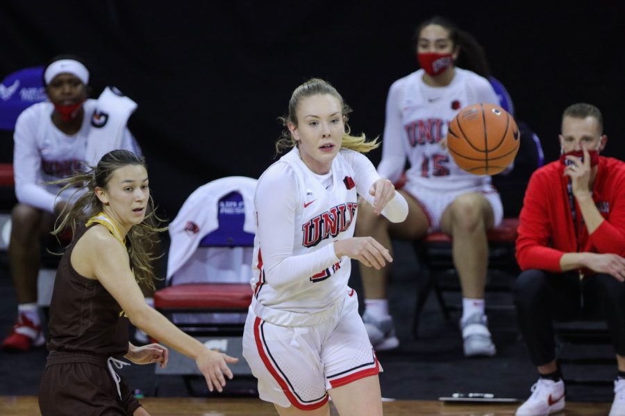 Delanynie Byrne (21) passes the ball to her teammates, during the Air Force Reserve Mountain West Women's basketball tournament Mar. 8. The University of Wyoming upsets the number 2 seed University of Las Vegas Nevada. 72- 56. (Devin Cornelius | Collegian)