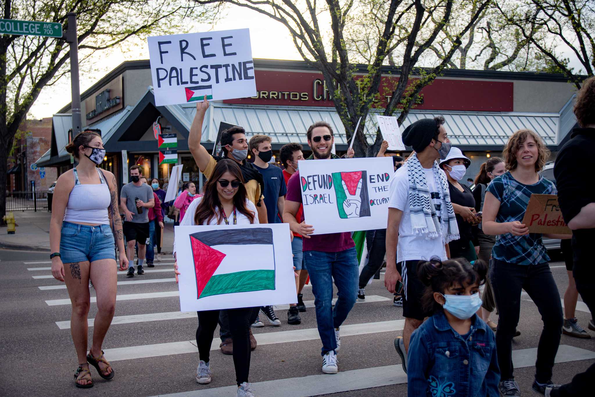 Free Palestine protestors marching on College Ave