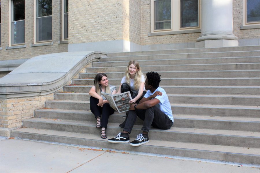 Katrina Leibee, Devin Cornelius, and Serena Bettis sit on the steps of the Administration Building at Colorado State University. Leibee is the editor in chief at The Rocky Mountain Collegian while Bettis is the content managing editor and Cornelius is the digital and design managing editor May 31. (Cat Blouch | Collegian File Photo) 