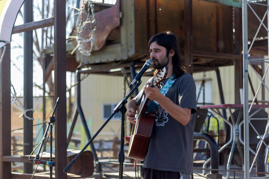 Jay LeCavalier performs at The Lyrics open mic night June 14. LeCavalier, whose band, The Crooked Rugs, performed at the Aggie Theatre June 12, spoke about The Lyrics Summer Solstice Festival before performing a series of original songs. (Michael Marquardt | The Collegian)