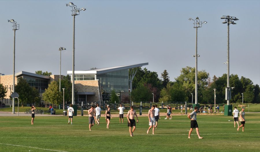 A group of students play a game of ultimate frisbee near the Student Recreation Center Aug. 28, 2021. 