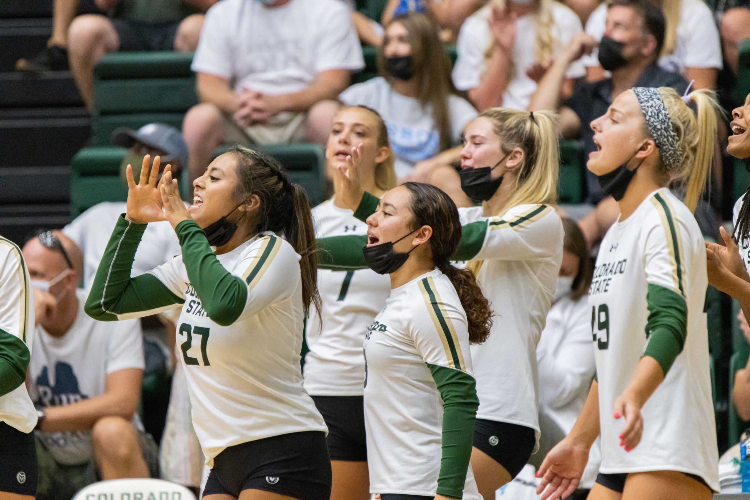 The Colorado State bench celebrates after the University scores