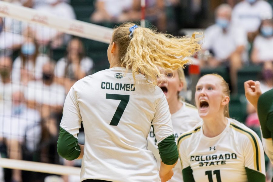 Sasha Colombo (7) and Ciera Pritchard (11) celebrate after Colombo scores a kill against Northwestern University, during the Colorado State season opening home game vs Northwestern. CSU loses 3-1. (Devin Cornelius | The Collegian)