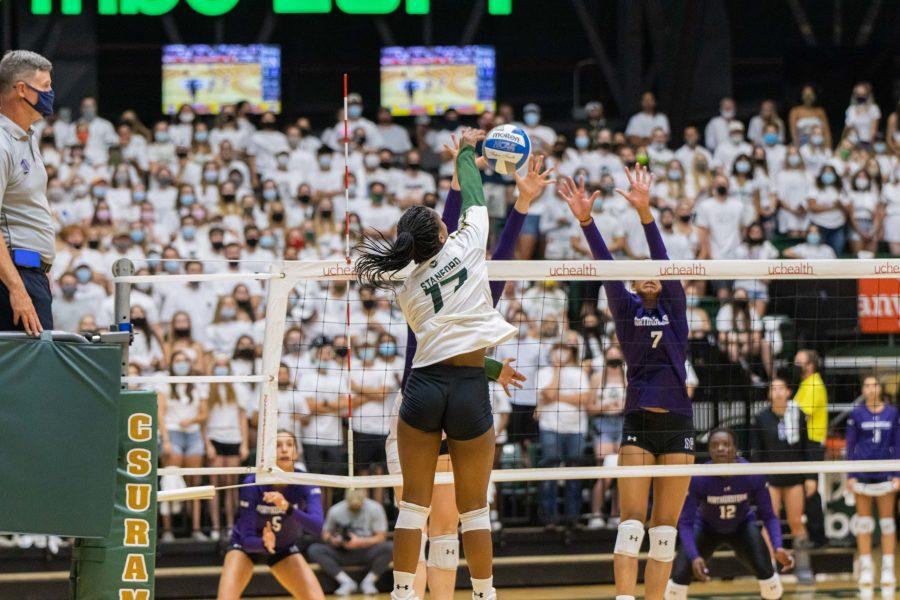 Kennedy Stanford (17) spikes the ball past Northwestern University defenders, during the Colorado State season opening home game vs Northwestern. CSU loses 3-1. (Devin Cornelius | The Collegian) 