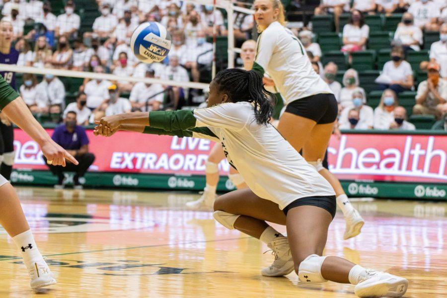 Kennedy Stanford (17) kneels down to pass the ball towards the setter, during the Colorado State University's opening match vs Northwestern University at Moby Arena. Northwestern wins 3-1. (Devin Cornelius | The Collegian)