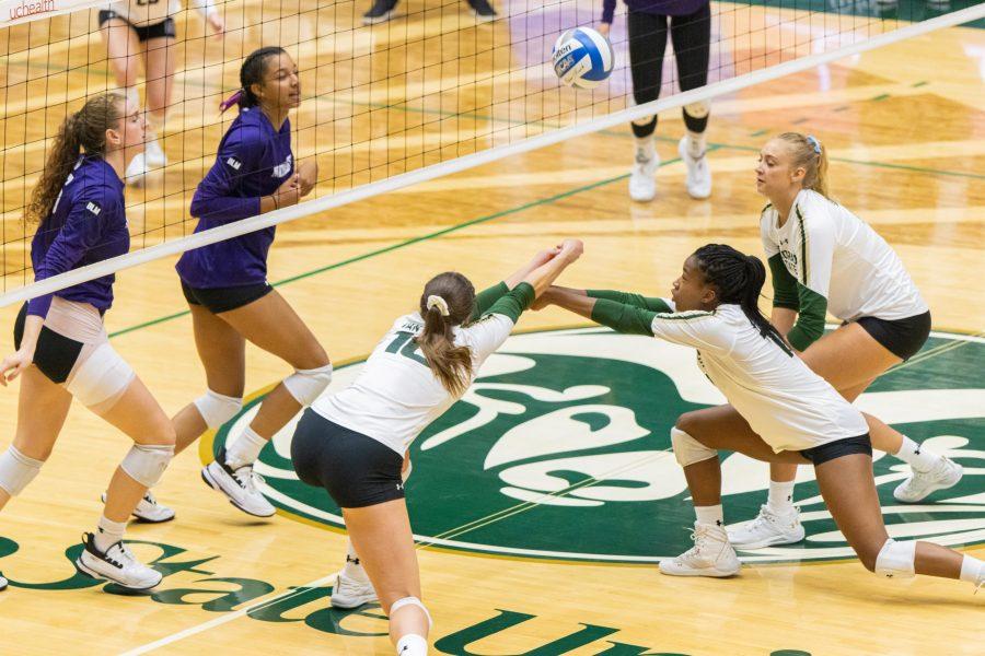 Jacqi Van Liefde (10) and Kennedy Stanford (17) keep the ball in play by stopping a tip attempt, during the Colorado State season opening game vs Northwestern University. CSU loses 3-1. (Devin Cornelius | Collegian)