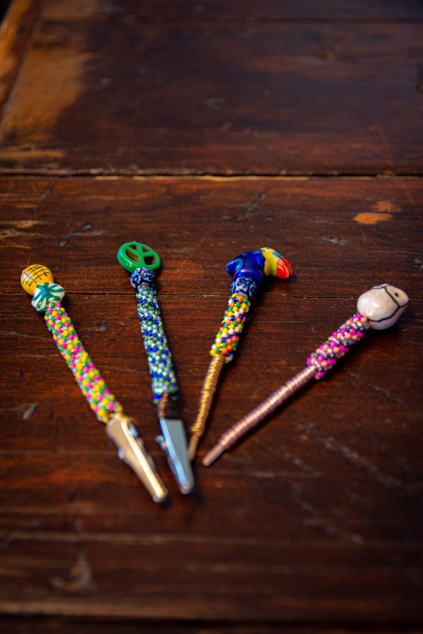 Photo illustration of handmade accessories such as: Roach clips, pokers and dab tools made from colorful beads and metal wires to heighten the experience of a smoke session Sept. 14. (Tri Duong | The Collegian)