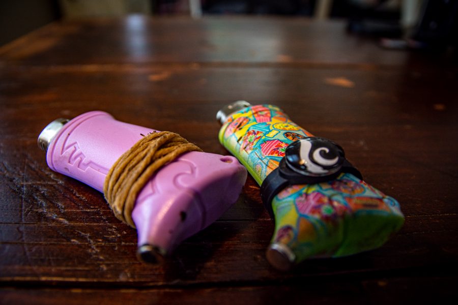 Photo illustration of lighters wrapped with hemp wick and charms that can improve the efficiency and cleanliness of a smoke session Sept. 14. (Tri Duong | The Collegian)