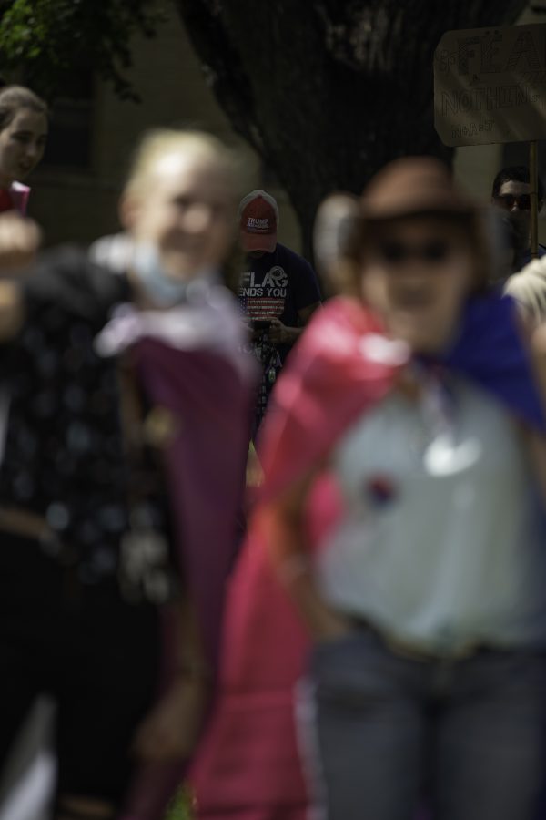 An unidentified person stands outside main gathering of Call Out CSU protest with Trump hat on. Though the persons name was not given, collegian photographers were told they were not their as counter protestors and were out simply to listen to what the speakers had to say. As well as that they were pro free speech and are against hate speech.  Garrett Mogel | The Collegian