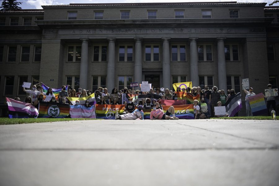 Members of the Call Out Colorado State University protest pose in front of the CSU Administrative Building after a protest against controversial discussion. (Garrett Mogel | The Collegian)