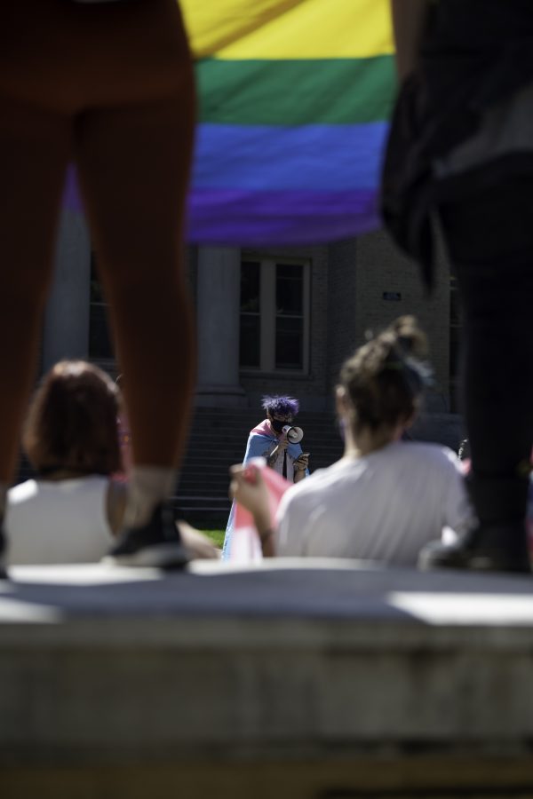 Alexander Low speaks about issues that LGBTQ+ members face at a Call Out Colorado State University protest in front of the Administrative Building South of the Oval Sept. 17. (Garrett Mogel | The Collegian)