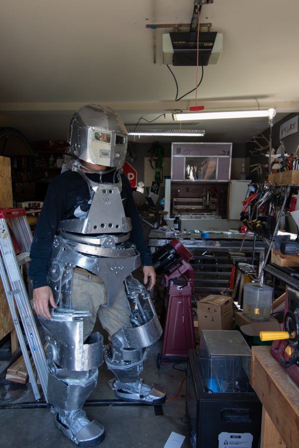 Dylan Edmiston showcases his Mark I Iron Man suit in his home workshop Sept. 19. Edmiston's workshop is where he has either made the tools himself or modified them to the specifications needed to create the suit. The suit has taken him three years to create, with a goal of having one of his future suits break the speed of sound. (Grayson Reed | The Collegian)