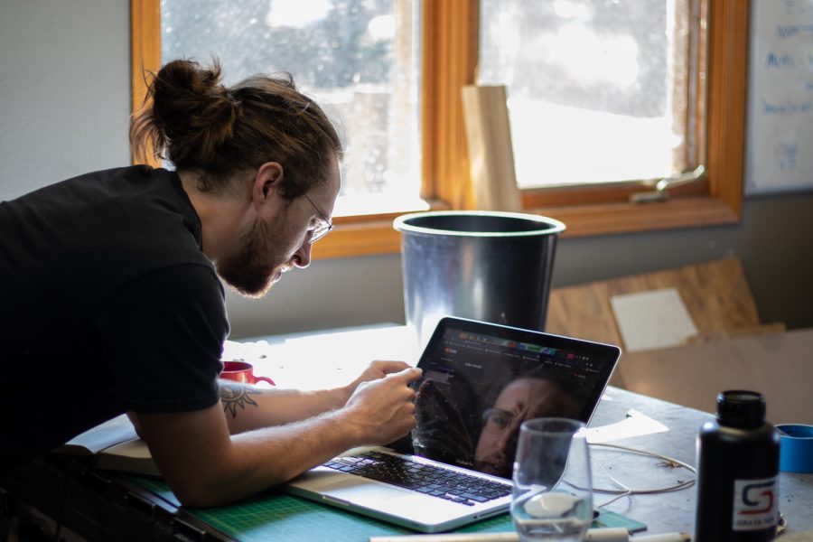 Dylan Edmiston, designer and manufacturer of the Mark I Iron Man suit, in his home workshop in Fort Collins, working on the next part of the suit, jet propulsion flight, Sept. 19. Edmiston’s current suit is a walking exoskeleton, but future suits will include flamethrower attachments and a system of flight that would allow the pilot to fly horizontally. (Grayson Reed | The Collegian)