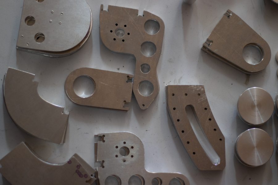 Dylan Edmiston, the designer and manufacturer of a Mark I Iron Man suit, showcases his complex metal components he is crafting himself Sept. 19. The components are used to give the suit structural strength and mobility, acting as the joints and bones of the exoskeleton that is the Mark I. (Grayson Reed | The Collegian)