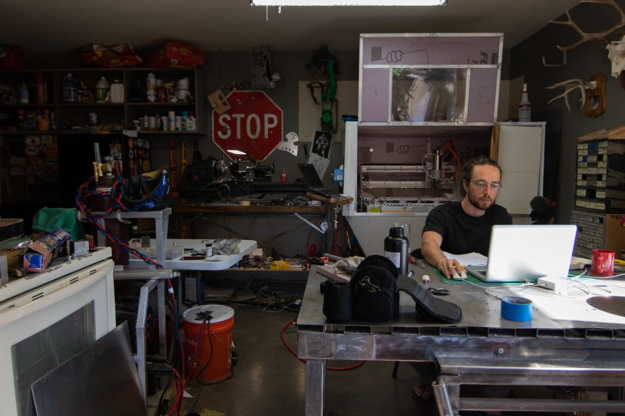 Dylan Edmiston in his home workshop, where he is designing and manufacturing his Mark I Iron Man suit Sept. 19. Edmiston is a YouTuber from Fort Collins who is looking for a second set of hands from Colorado State University and surrounding areas to help with the labor of manufacturing. (Grayson Reed | The Collegian)