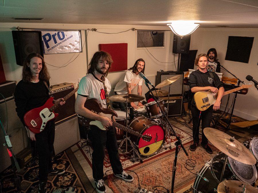 The members of the Crooked Rugs pose for a picture during band practice Sept. 22. Their album THAT! releases Sept. 24. (Tri Duong | The Collegian)