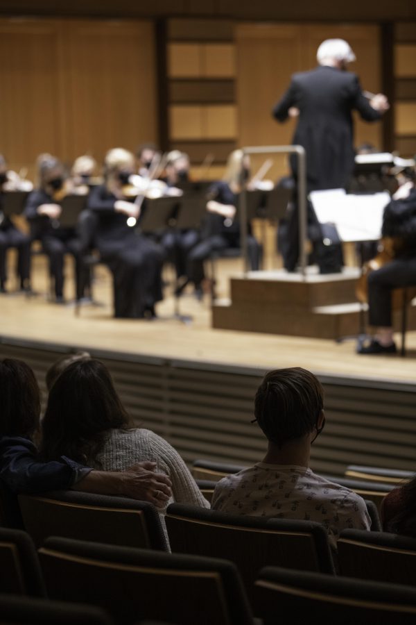 Audience members watch the Colorado State University Orchestra perform for the first time in nearly 20 months in the Griffin Concert hall Sept. 24. (Garrett Mogel | The Collegian)