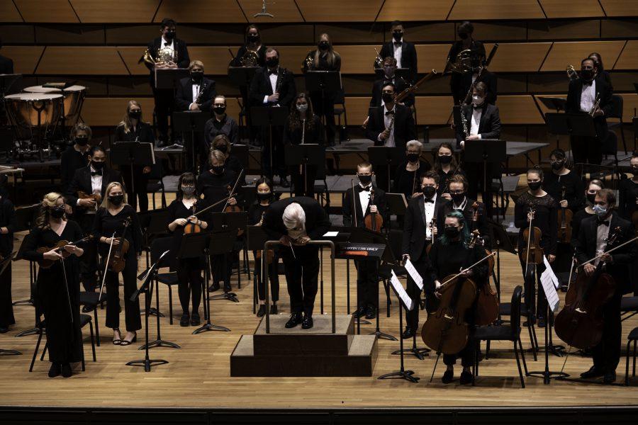 Conductor Wes Kenney takes a bow before the Colorado State University Orchestra takes intermission. The symphony took place Sept. 23 at the Griffin Concert Hall and was the first in person symphony in nearly 20 months. (Garrett Mogel | The Collegian)